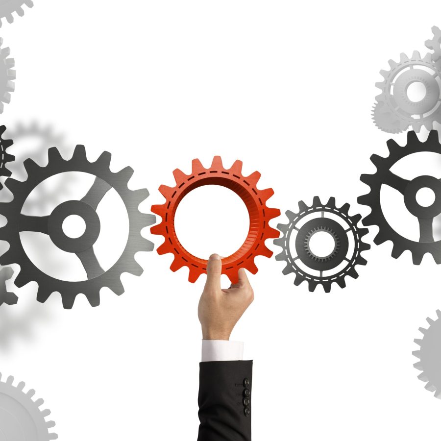 Businessman builds a business system with gear