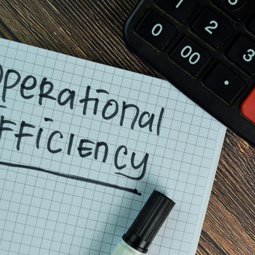 Operational Efficiency write on a book isolated on Wooden Table.